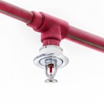red pipe with fire sprinkler attached - One Environmental